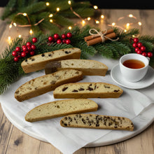 Load image into Gallery viewer, Assorted Biscotti Cookies on a dish with a cup of tea in Christmas theme background