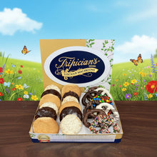 Load image into Gallery viewer, Box of assorted macaroons with Tripician's logo on a red background