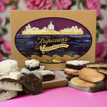 Load image into Gallery viewer, A box of macaroon sampler with various flavors displayed in front, including almond, coconut, and chocolate-covered varieties, alongside Boardwalk brownies with coconut macaroon toppings.
