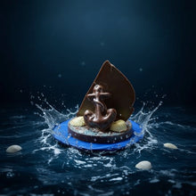 Load image into Gallery viewer, a 3-dimensional chocolate sailboat with seashelss and a anchor
